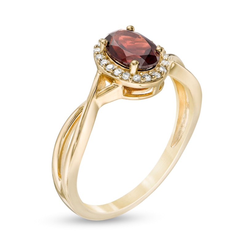 Main Image 3 of Oval Garnet and 0.08 CT. T.W. Diamond Frame Twist Shank Ring in 10K Gold