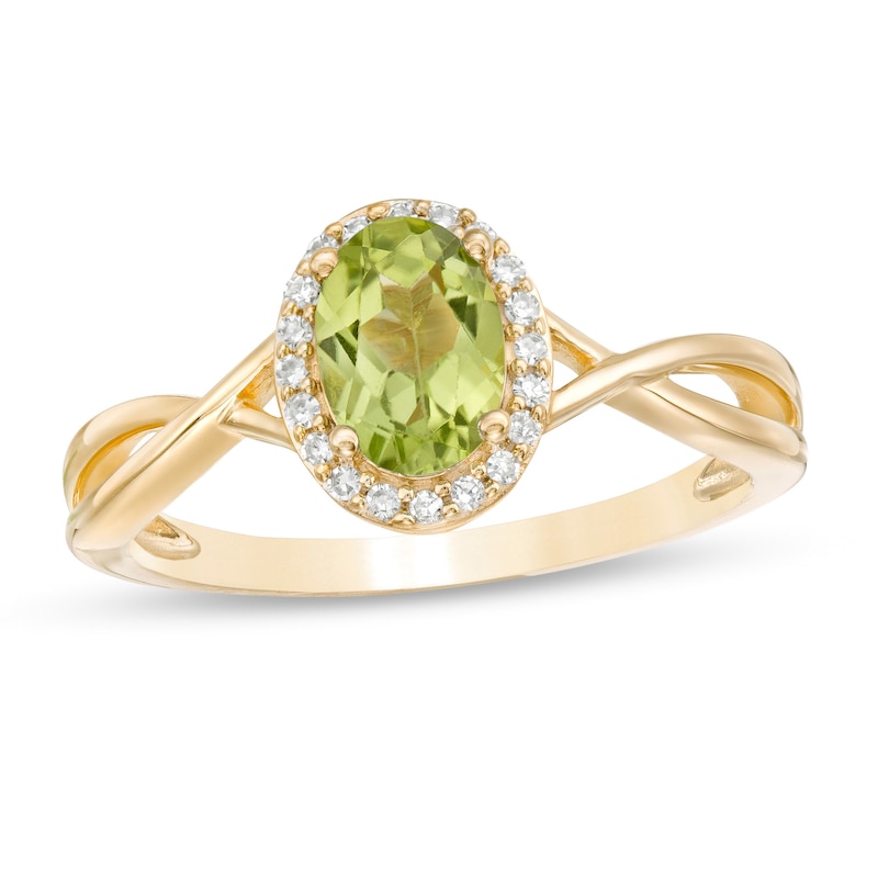 Oval Peridot and 0.08 CT. T.W. Diamond Frame Twist Shank Ring in 10K Gold