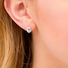 Thumbnail Image 1 of Oval Swiss Blue Topaz and 0.088 CT. T.W. Diamond Frame Stud Earrings in 10K Gold