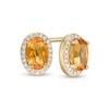Thumbnail Image 0 of Oval Citrine and 0.088 CT. T.W. Diamond Frame Stud Earrings in 10K Gold