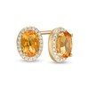 Thumbnail Image 1 of Oval Citrine and 0.088 CT. T.W. Diamond Frame Stud Earrings in 10K Gold