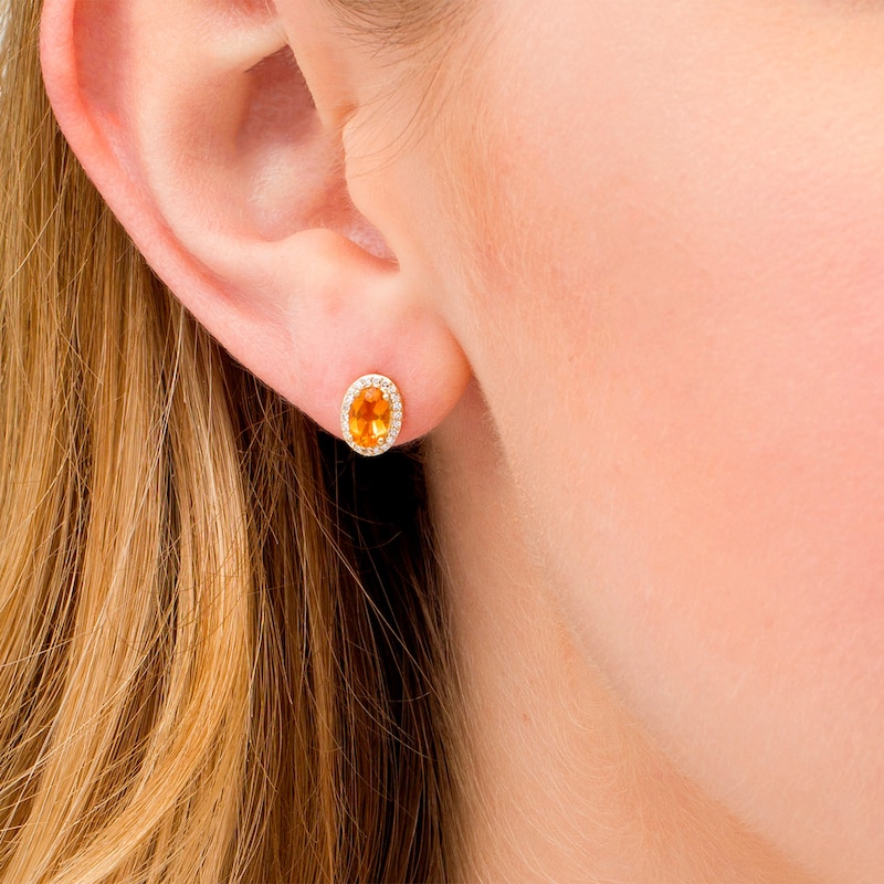 Main Image 2 of Oval Citrine and 0.088 CT. T.W. Diamond Frame Stud Earrings in 10K Gold