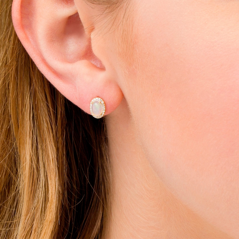 Main Image 2 of Oval Opal and 0.088 CT. T.W. Diamond Frame Stud Earrings in 10K Gold