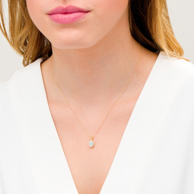 Main Image 2 of Oval Opal and 0.08 CT. T.W. Diamond Frame Twisted Split Bail Pendant in 10K Gold