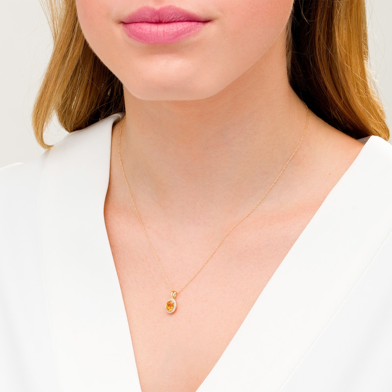 Main Image 2 of Oval Citrine and 0.08 CT. T.W. Diamond Frame Twisted Split Bail Pendant in 10K Gold
