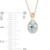 Thumbnail Image 2 of Oval Swiss Blue Topaz and 0.08 CT. T.W. Diamond Frame Twisted Split Bail Pendant in 10K Gold