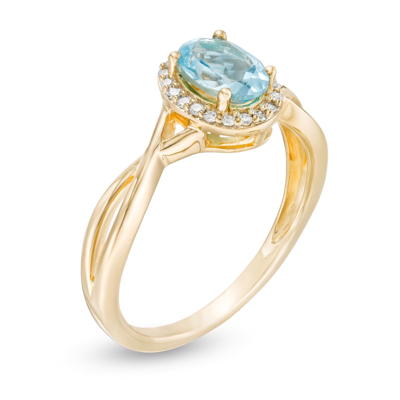 Main Image 3 of Oval Swiss Blue Topaz and 0.08 CT. T.W. Diamond Frame Twist Shank Ring in 10K Gold