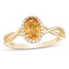 Thumbnail Image 0 of Oval Citrine and 0.08 CT. T.W. Diamond Frame Twist Shank Ring in 10K Gold