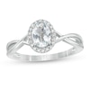 Thumbnail Image 0 of Oval Aquamarine and 0.08 CT. T.W. Diamond Frame Twist Shank Ring in 10K White Gold
