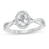 Thumbnail Image 1 of Oval Aquamarine and 0.08 CT. T.W. Diamond Frame Twist Shank Ring in 10K White Gold