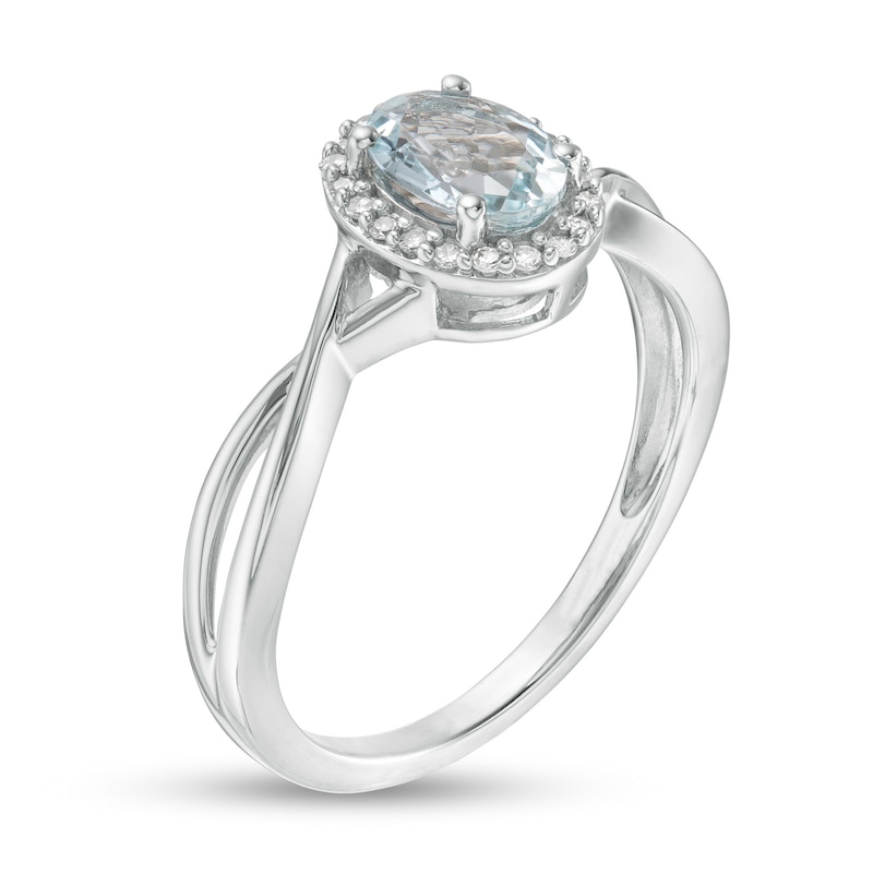 Oval Aquamarine and 0.08 CT. T.W. Diamond Frame Twist Shank Ring in 10K White Gold