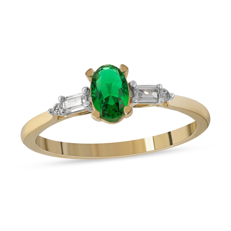 Oval Emerald and 0.10 CT. T.W. Baguette and Round Diamond Side Accent Ring in 10K Gold