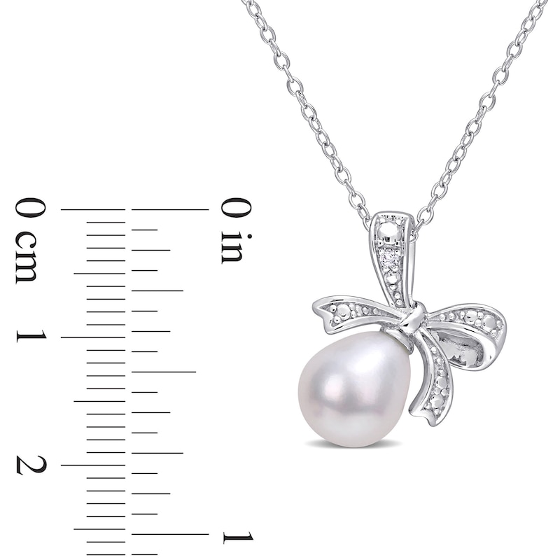8.5-9.0mm Oval Cultured Freshwater Pearl and Diamond Accent Bow Pendant in Sterling Silver