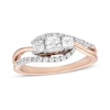 Thumbnail Image 0 of 0.69 CT. T.W. Princess-Cut and Round Diamond Three Stone Bypass Ring in 10K Rose Gold
