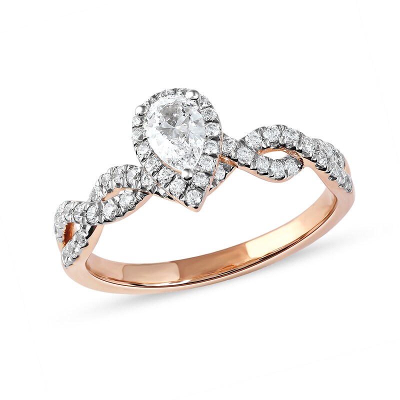 0.75 CT. T.W. Pear-Shaped Diamond Frame Twist Shank Engagement Ring in 10K Rose Gold (I/I1)