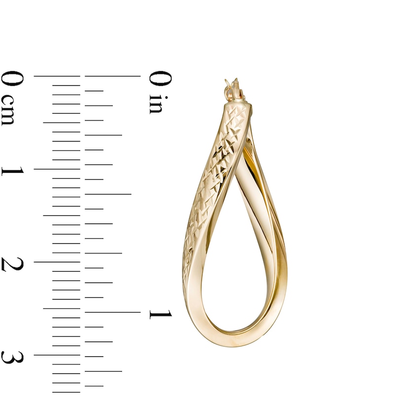 Italian Gold 30.0 x 10.0mm Multi-Finish Wave Flat Tube Oval Hoop Earrings in 14K Gold