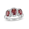 Thumbnail Image 0 of Oval Garnet and White Lab-Created Sapphire Frame Three Stone Ring in Sterling Silver