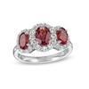 Oval Garnet and White Lab-Created Sapphire Frame Three Stone Ring in Sterling Silver