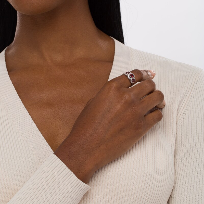 Oval Garnet and White Lab-Created Sapphire Frame Three Stone Ring in Sterling Silver