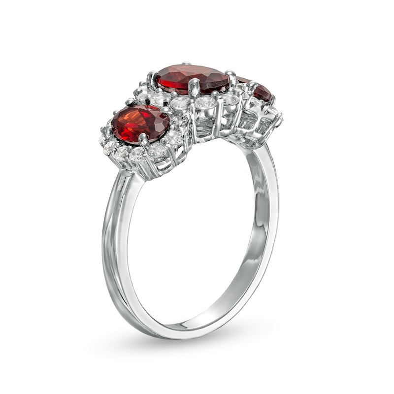 Oval Garnet and White Lab-Created Sapphire Frame Three Stone Ring in Sterling Silver
