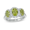Thumbnail Image 0 of Oval Peridot and White Lab-Created Sapphire Frame Three Stone Ring in Sterling Silver