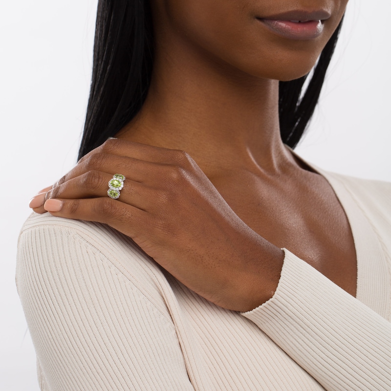 Oval Peridot and White Lab-Created Sapphire Frame Three Stone Ring in Sterling Silver