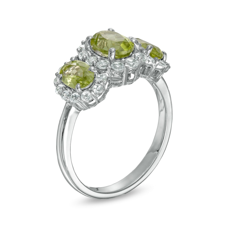 Oval Peridot and White Lab-Created Sapphire Frame Three Stone Ring in Sterling Silver