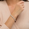 Thumbnail Image 2 of 5.0mm White Lab-Created Sapphire and 0.04 CT. T.W. Diamond Oval Frame Line Bracelet in Sterling Silver - 7.5"