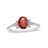 Thumbnail Image 0 of Oval Garnet and 0.086 CT. T.W. Diamond Leaf-Sides Floral Ring in 10K White Gold