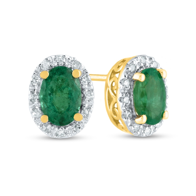 Oval Emerald and 0.10 CT. T.W. Diamond Frame Stud Earrings in 14K Gold
