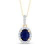 Oval Blue Sapphire and 0.12 CT. T.W. Diamond Frame Drop Pendant in 14K Gold
