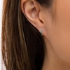 Thumbnail Image 2 of Emerald Huggie Hoop Earrings in 10K White Gold
