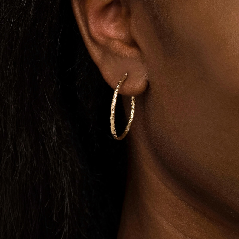 Main Image 2 of 30.0mm Diamond-Cut Inside-Out Tube Oval Hoop Earrings in Hollow 10K Gold
