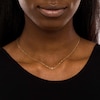 Thumbnail Image 2 of Sideways Diamond-Cut Bead Cross Necklace in 10K Gold - 17"
