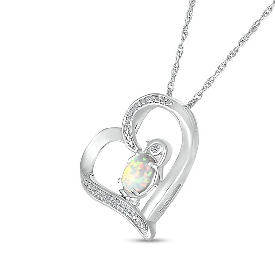 Oval Lab-Created Opal and 0.04 CT. T.W. Diamond Penguin in Tilted Heart Outline Pendant in Sterling Silver