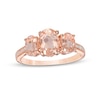 Thumbnail Image 0 of Oval Morganite and 0.04 CT. T.W. Diamond Three Stone Ring in 10K Rose Gold