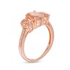 Thumbnail Image 2 of Oval Morganite and 0.04 CT. T.W. Diamond Three Stone Ring in 10K Rose Gold