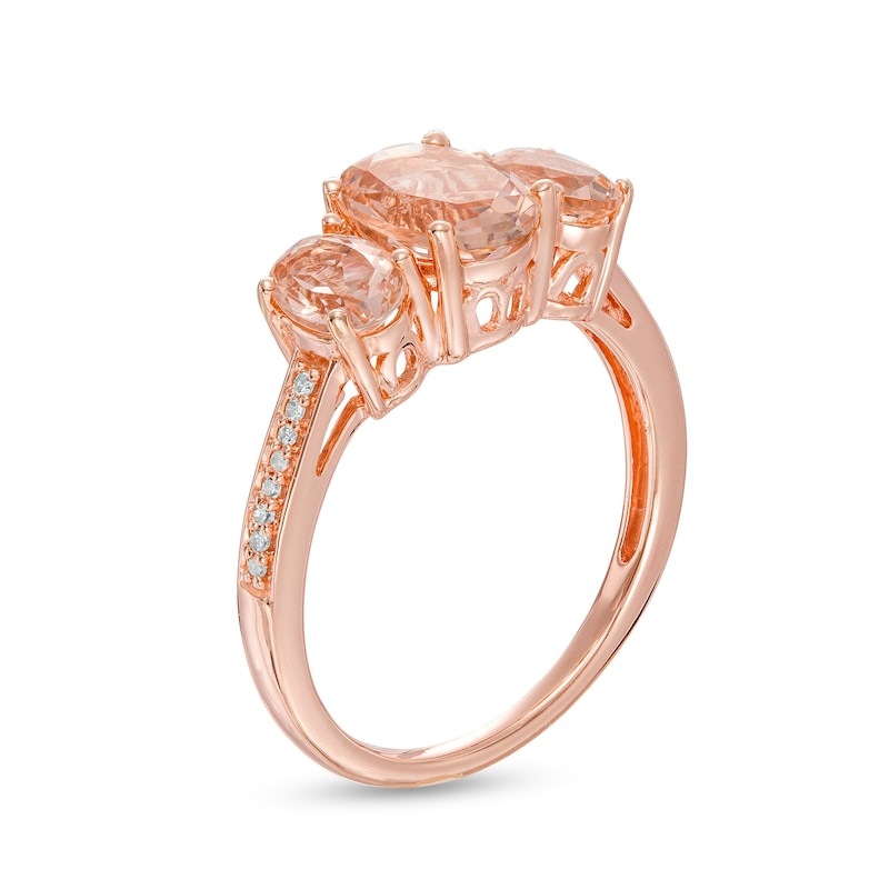 Oval Morganite and 0.04 CT. T.W. Diamond Three Stone Ring in 10K Rose Gold