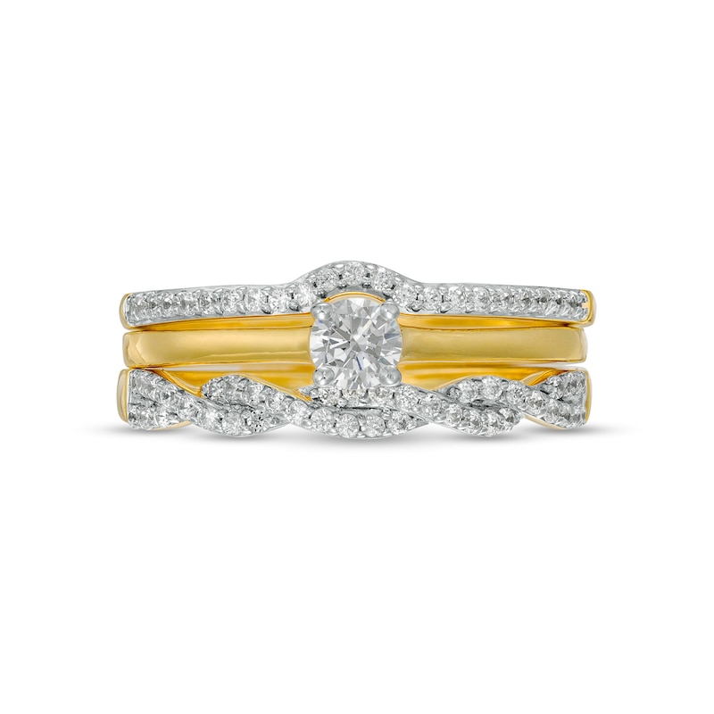 0.45 CT. T.W. Diamond Twist Three Piece Bridal Set in 10K Gold (J/I3)
