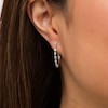 Thumbnail Image 3 of Marilyn Monroe™ Collection 0.50 CT. T.W. Baguette Diamond Hoop Earrings in 10K White Gold