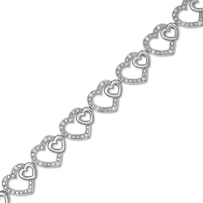 0.25 CT. T.W. Diamond Hearts Line Bracelet in Sterling Silver - 7.5"|Peoples Jewellers