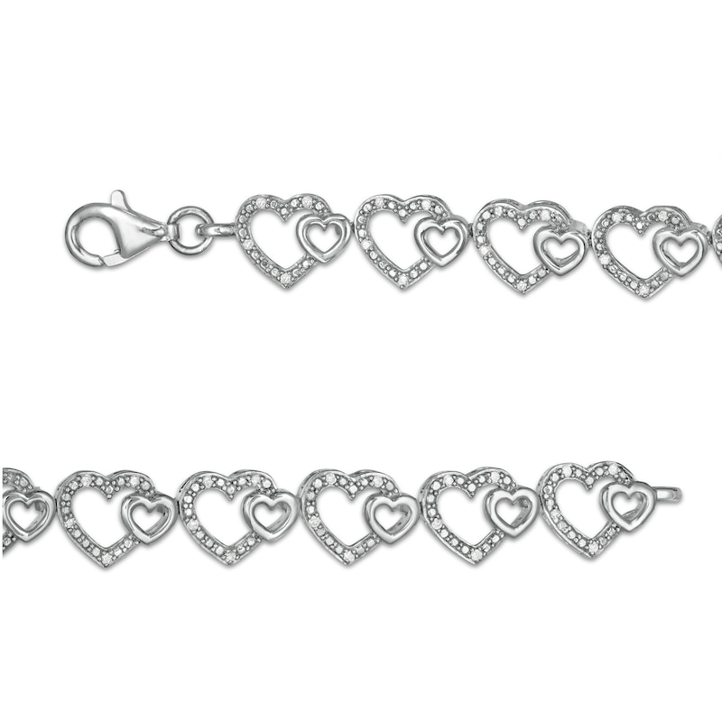 0.25 CT. T.W. Diamond Hearts Line Bracelet in Sterling Silver - 7.5"