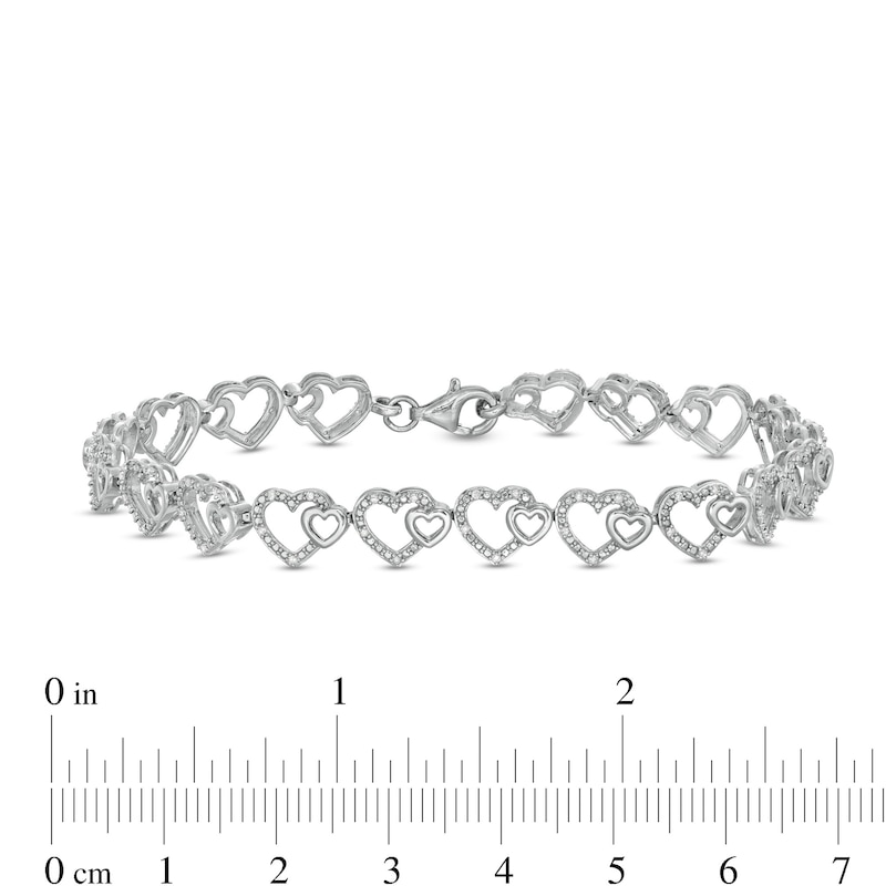 0.25 CT. T.W. Diamond Hearts Line Bracelet in Sterling Silver - 7.5"
