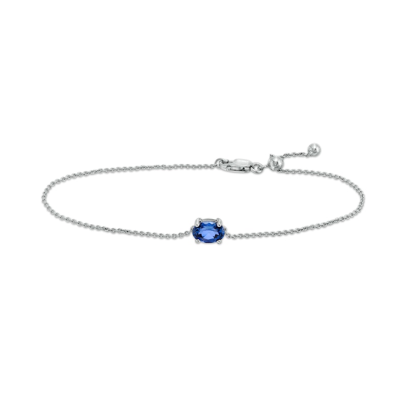 Sideways Oval Blue Lab-Created Sapphire Solitaire Adjustable Bracelet in 10K White Gold - 7.5"|Peoples Jewellers