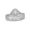 Thumbnail Image 0 of 0.58 CT. T.W. Oval Diamond Double Frame Twist Shank Bridal Set in 10K White Gold (I/I2)