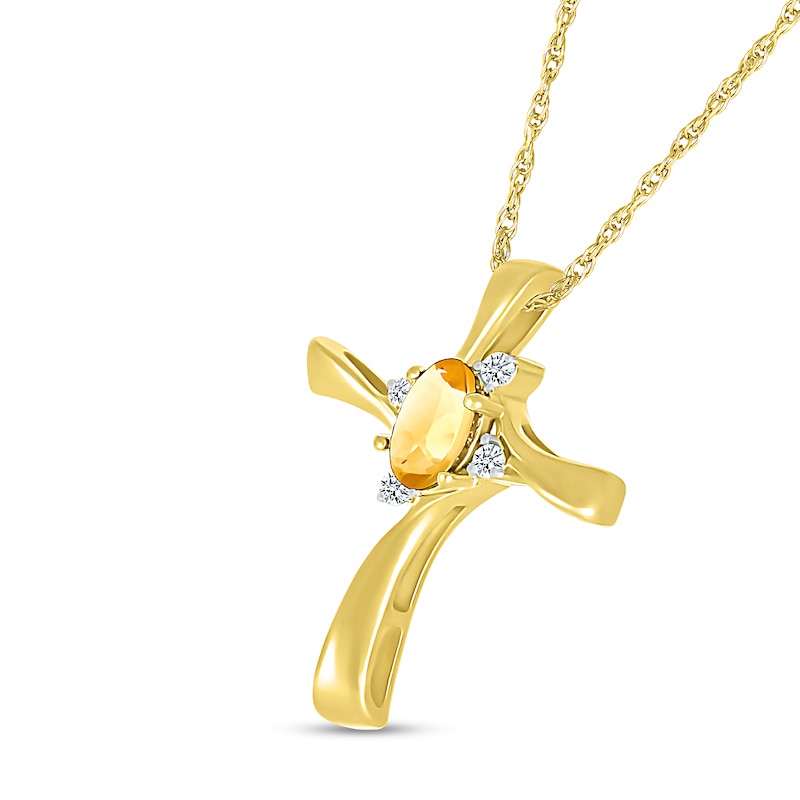 Oval Citrine and Diamond Accent Swirl Ribbon Cross Pendant in 10K Gold