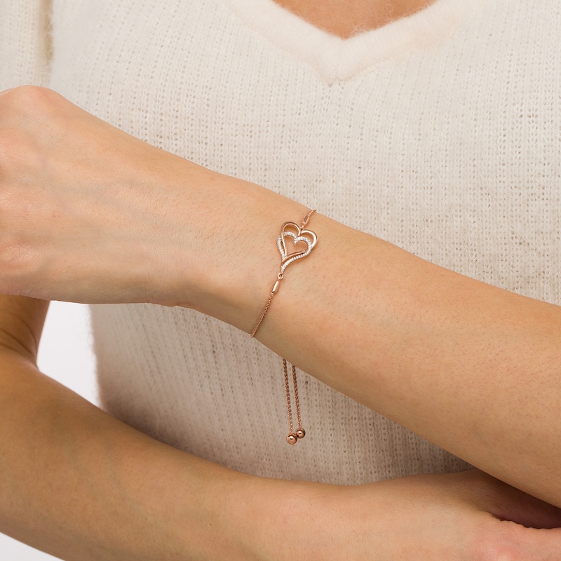 Main Image 2 of 0.088 CT. T.W. Diamond Interlocking Double Elongated Heart Bolo Bracelet in Sterling Silver with 14K Rose Gold Plate