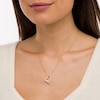 Thumbnail Image 1 of 0.23 CT. T.W. Baguette and Round Diamond Tilted Scatter Heart Pendant in 10K Gold