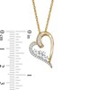 0.23 CT. T.W. Baguette and Round Diamond Tilted Scatter Heart Pendant in 10K Gold