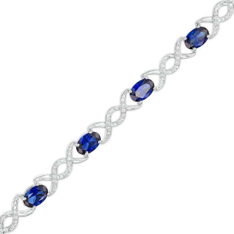 Oval Lab-Created Sapphire and 0.18 CT. T.W. Diamond Infinity Ribbon Link Line Bracelet in Sterling Silver – 7.5"|Peoples Jewellers